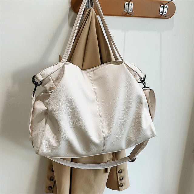 The sleek design is crafted from soft leather for a luxe look and feel and features plenty of space for all your essentials. The detachable strap means you can carry it as a crossbody bag or over your shoulder, and the top zip closure ensures everything stays safe and secure.