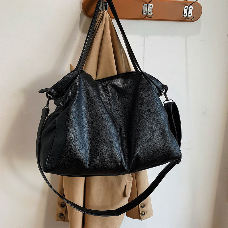 The sleek design is crafted from soft leather for a luxe look and feel and features plenty of space for all your essentials. The detachable strap means you can carry it as a crossbody bag or over your shoulder, and the top zip closure ensures everything stays safe and secure.